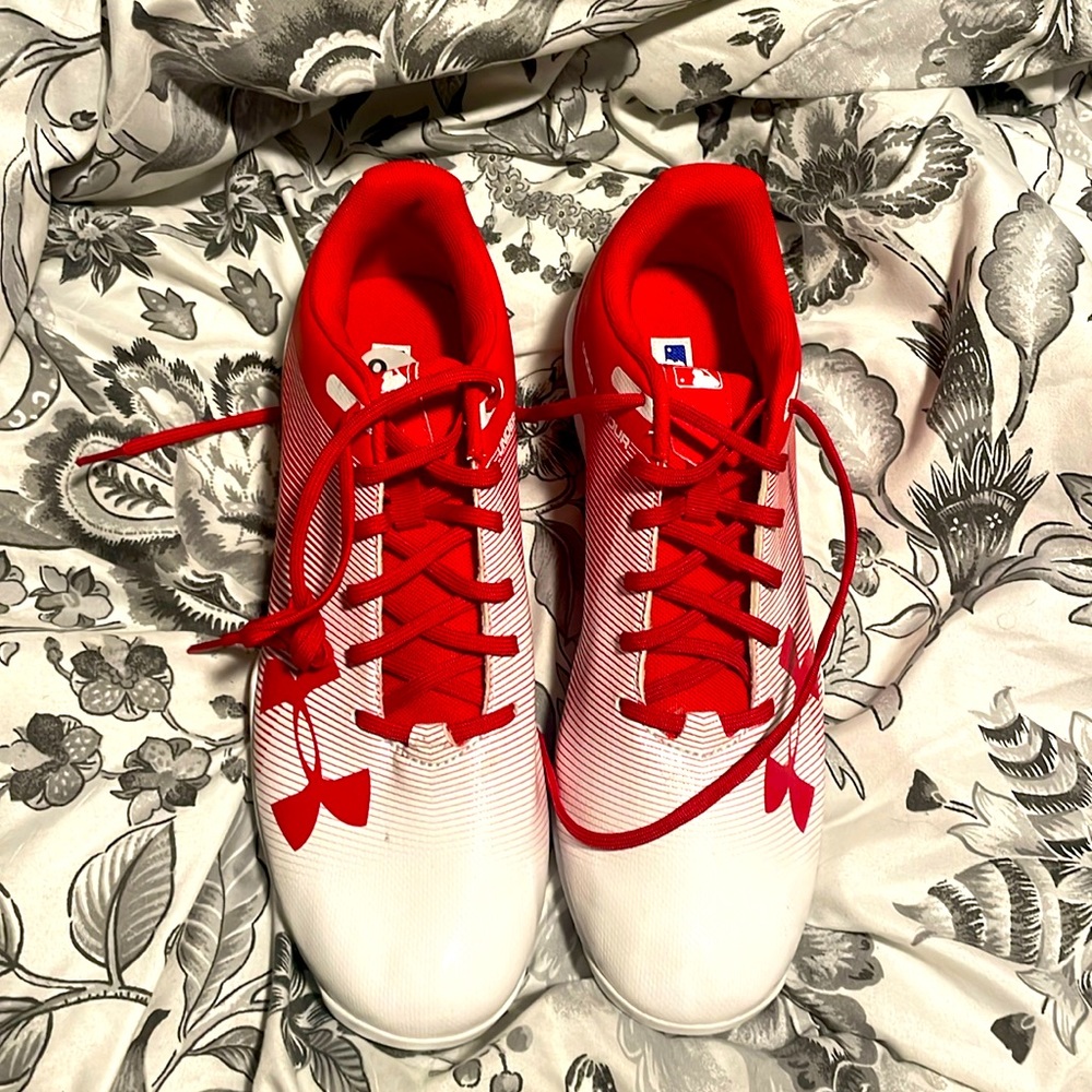 Brand new never used red and white under armour cleats size 9.5 men